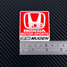 Красная эмблема МЮГЕН - Хонда Мотор Спорт - Размер 55 * 58 мм. Алюминий.