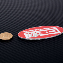 Тюнинг эмблема ТРД (TRD) Toyota Racing Development - Овал с зеркальными буквами - Размер 80 * 38 мм.