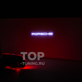 Проекция логотипа Porsche для Cayenne E3