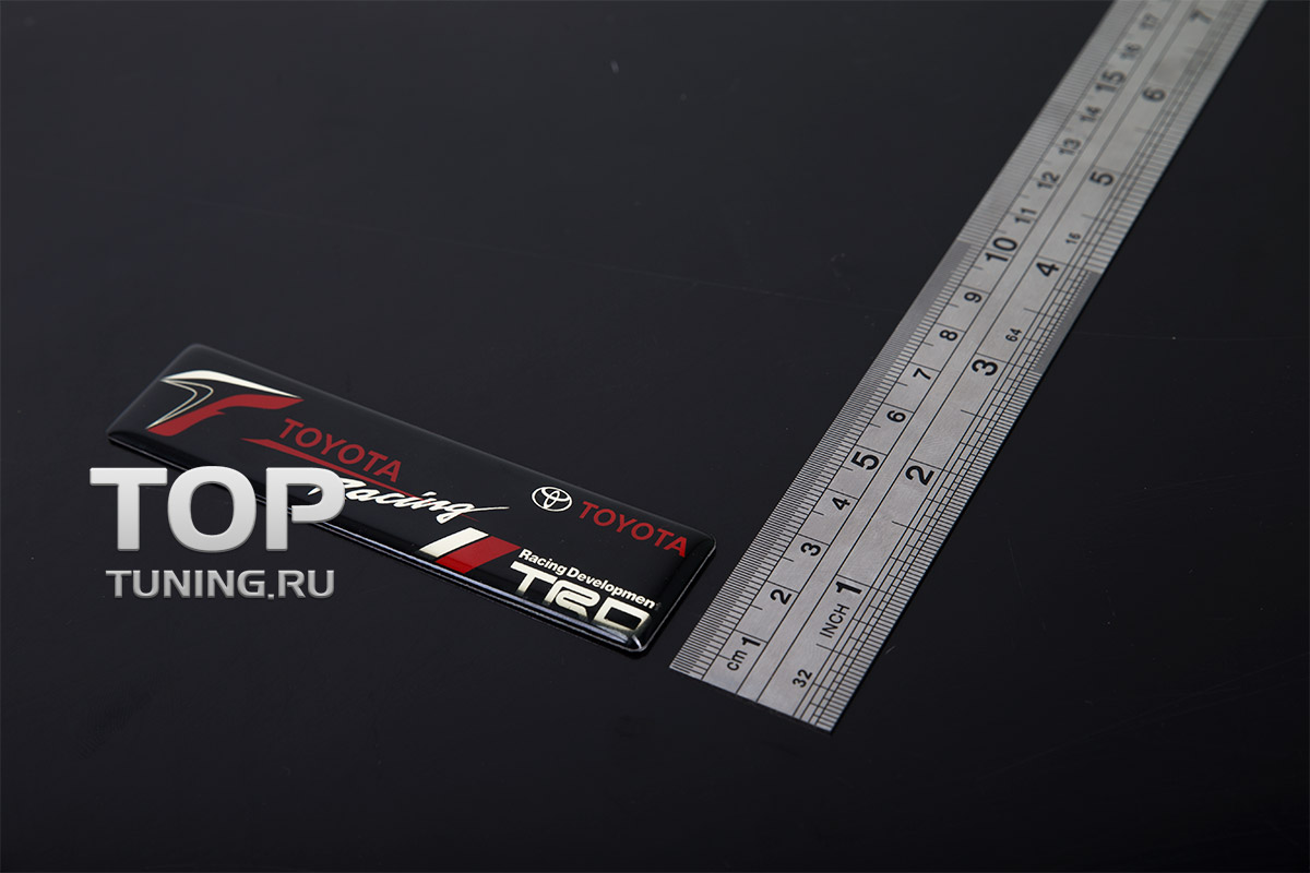 6366 Шильдик TRD 100x24 на Toyota Эмблема наклейка TRD в эластичной смоле, на карбоновой основе. Размер 100 * 24 mm.