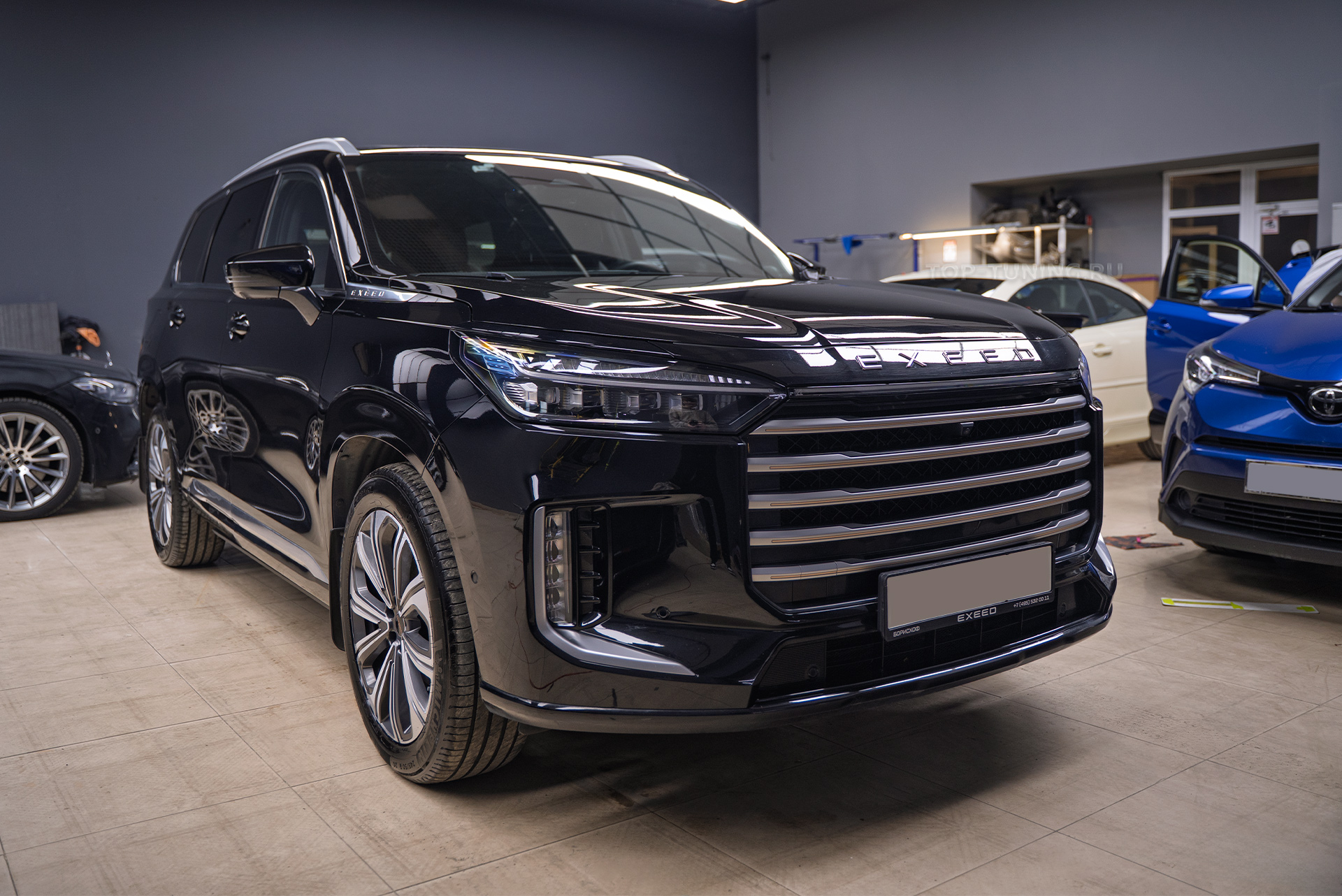 Оклейка мультимедиа и приборной панели Exeed VX рестайлинг 