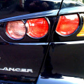 Накладки на задние фонари Ralliart на Mitsubishi Lancer 10 (X)