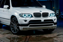 Передний бампер 4.6 IS - Обвес Перформанс — Тюнинг БМВ Х5 Е53 (Рестайлинг) 2003-2006 ABS пластик / Под окраску / Сетки в комплекте (только черные) / Без отверстий под ДХО