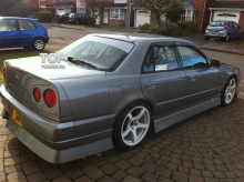 6199 Задний бампер Uras на Nissan Skyline R34