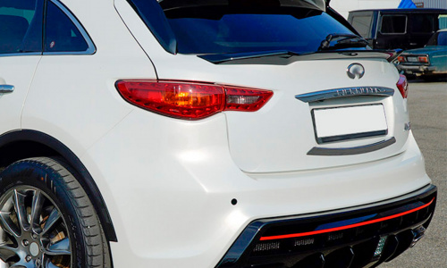 Задний бампер Draco SLIM с насадками  для Infiniti QX70 (FX35, 37, 50)